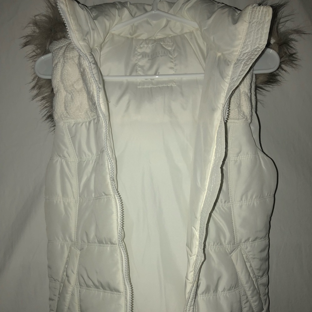 White vest with fur hood